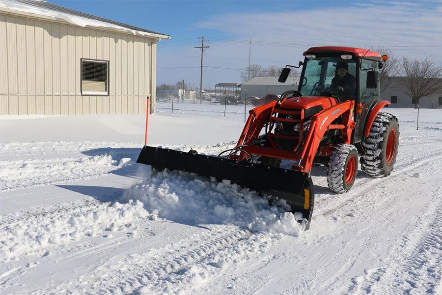 Snow Removal With A Tractor Plow
